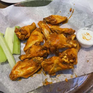 Mild hot wings with celery and blue cheese.