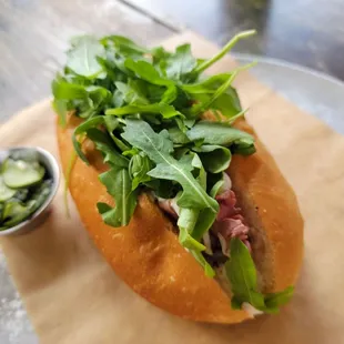 a sandwich with lettuce and meat