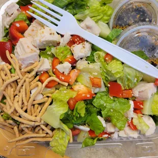 a salad in a plastic container