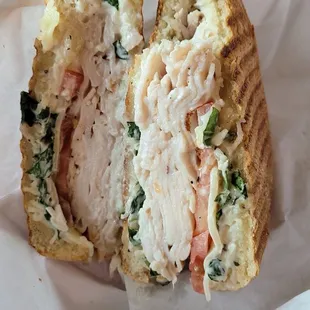 (One bite of) the basil turkey panini