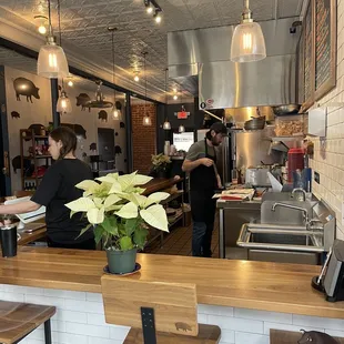 a kitchen with a counter and stools