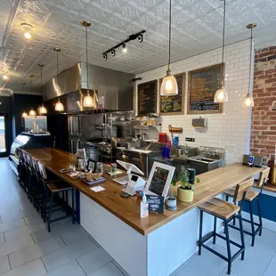 a restaurant with a counter and a bar