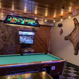a pool table and a television
