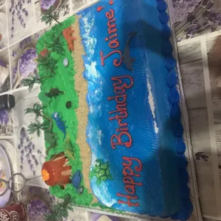 a cake with a picture of a beach scene on it