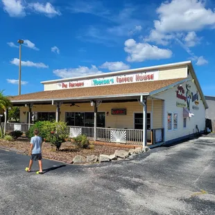 a man walking in front of the pie factory
