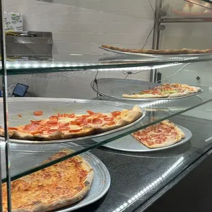 the pizzas on the counter