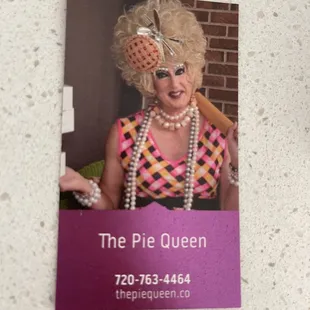 a woman in a wig and pearls