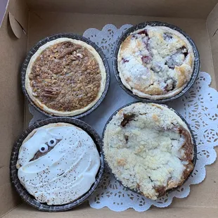 Top left pecan, top right berry, bottom left chocolate cream, bottom right apple