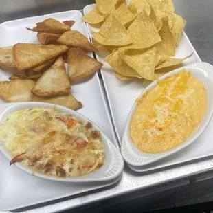 Lobster and artichoke dip with fried pita and buffalo chicken dip with chips