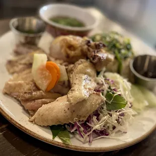 HAINAN CHICKEN RICE a southeast asian classic, chicken fat pandan rice, side broth, cucumber, rau ram herb &amp; cabbage salad,