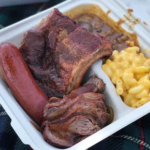 Three meat combo - hot link, baby back ribs, tri-tip with Bourbon Baked Beans and Creamy Mac-N-Cheese