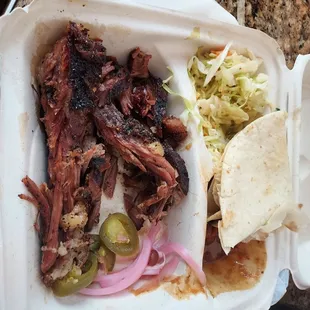 Brisket with sides of beans and coleslaw