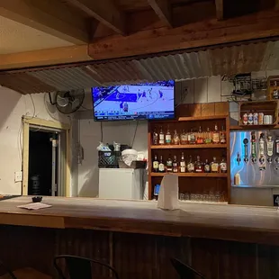 a bar with a flat screen tv