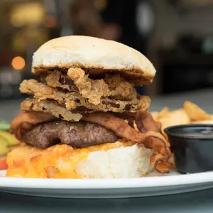 a burger and fries on a plate