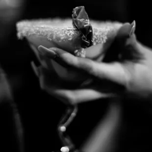 a woman holding a glass of wine