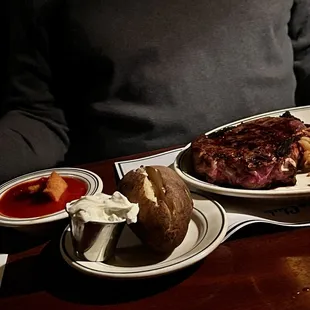 Bone-in ribeye, stewed tomatoes, onion straws and baked potato!