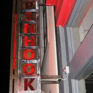 a neon sign for a restaurant