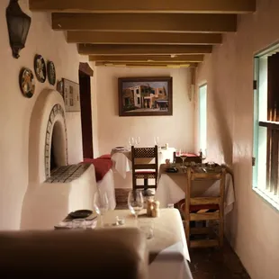 a dining room with a table and chairs