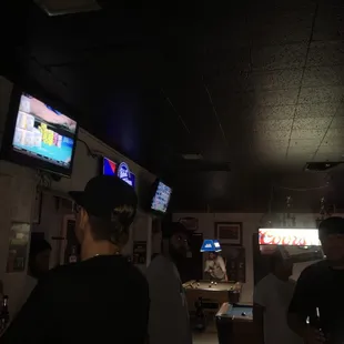 a group of people watching televisions