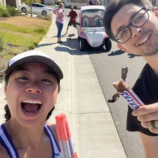 a man and a woman eating ice cream