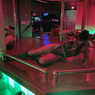 a woman laying on a bar