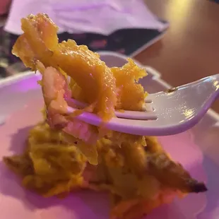 a fork with a piece of food on it