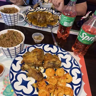 Creole Chicken &amp; Shrimp and Oxtails with rice and peas and pink potatoes.