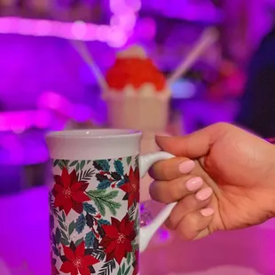 a person holding a coffee cup