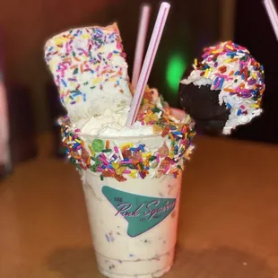 a milkshake with sprinkles and marshmallows