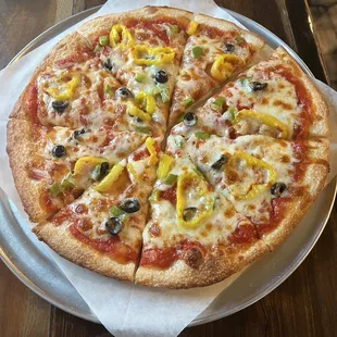 Medium pizza with veggies. Sauce was yummy. Cheese is great, good stretch.
