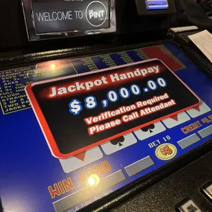 a slot machine with a welcome sign