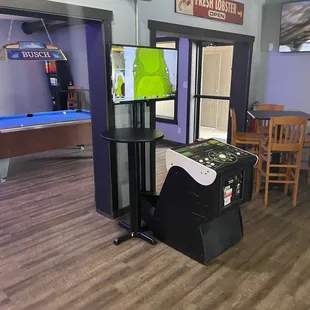 a game room with a pool table