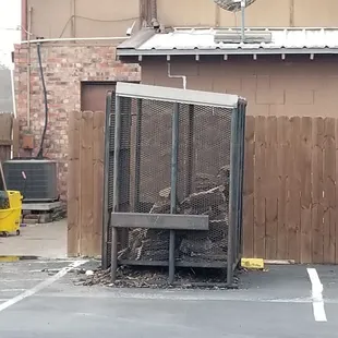 The wood in the back of the restuarant for the que