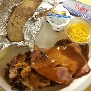 Fall apart tender &apos;moist&apos; brisket. Smoky, slightly sweet ham. Baked potato with all the fixin&apos;s. Time to feast like a BEAST!