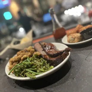 Pork sampler with pull pork, brisket, and chopped pork. Green beans and fried okra! Delicious!