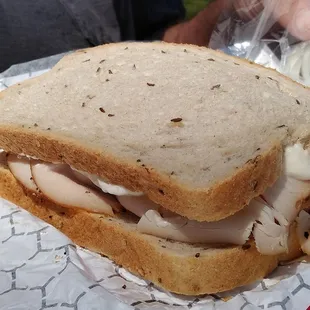 Pit turkey on rye with tiger sauce and onions.