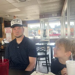 Having a meal with my youngest son, Bert and my only grandson, Kam.