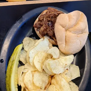 a plate of chips and a sandwich