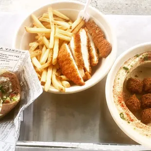 two bowls of food on a tray