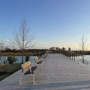 a boardwalk with benches on it
