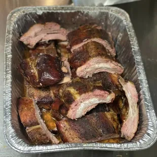 a tray of meat in a kitchen