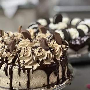a cake with chocolate frosting and cookies on top