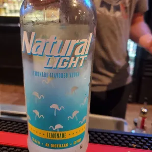 a person holding a bottle of water