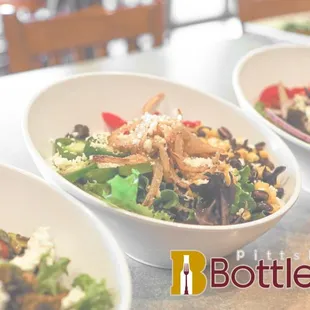 three bowls of salad