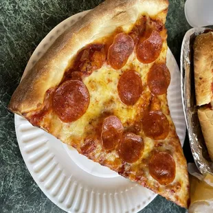 Pizza By The Slice, $4.25 + $1 (1 topping)