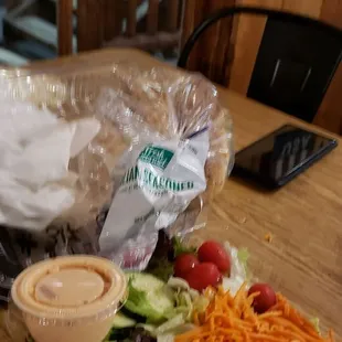 Pepperoni jalapeno and sausage pizza and a salad we also bought jalapeno sourdough bread