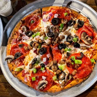 Delicious Cauliflower crust supreme pizza with ranch on the side of course.