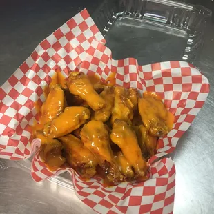 We have wings in orders of 6 and 12, with your choice of sauce. These are a dozen of our mild wings.