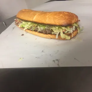 One of our steak hoagies right off the grill! Try any of our hoagies in halves or a whole!