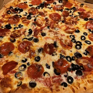 a pepperoni and olive pizza